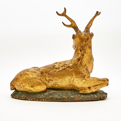 Lot 633 - Continental Painted and Parcel-Gilt Carved Wood Figure of a Recumbent Stag