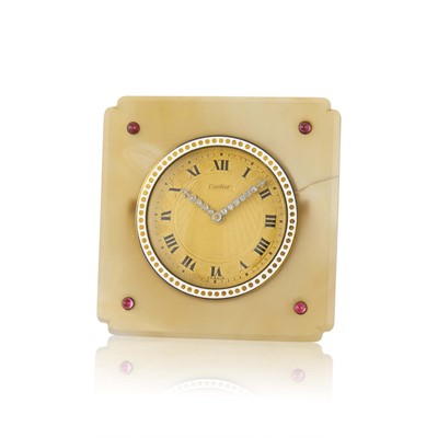 Lot 71 - Cartier Agate, Cabochon Ruby, Diamond and Enamel Desk Clock, France