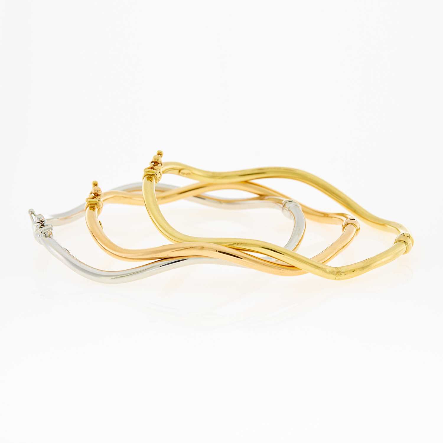Lot 1043 - Three Rose, Yellow and White Gold Bracelets