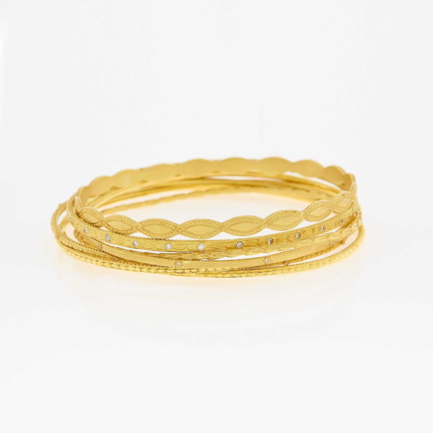 Lot 1041 - Seven Gold and Diamond Bangle Bracelets