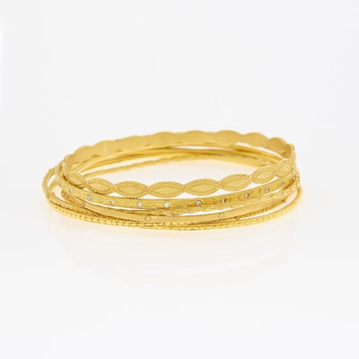 Lot 1041 - Seven Gold and Diamond Bangle Bracelets