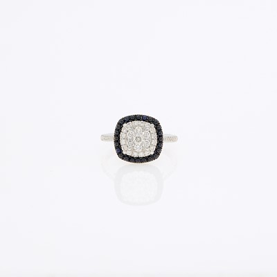 Lot 1076 - White Gold, Cabochon Sapphire and Diamond Ring