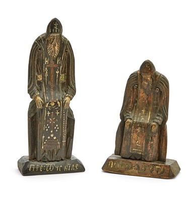 Lot 99 - Two Russian Carved and Painted Wood Figures of St. Nilus Stolobensky