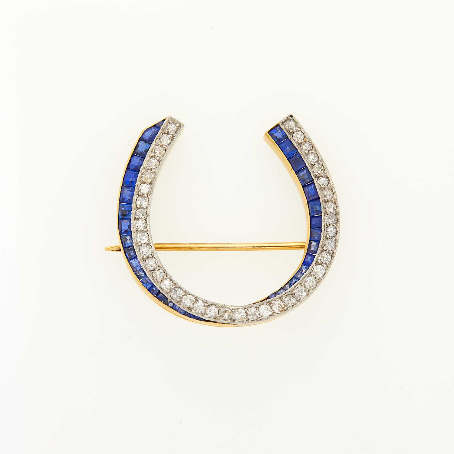Lot 1157 - Gold, Platinum, Diamond and Sapphire Horseshoe Pin