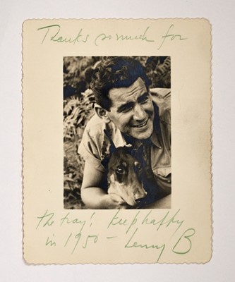 Lot 5172 - An inscribed photograph of a young Leonard Bernstein with his beloved Doberman
