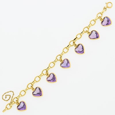 Lot 1146 - Gold and Amethyst Charm Bracelet