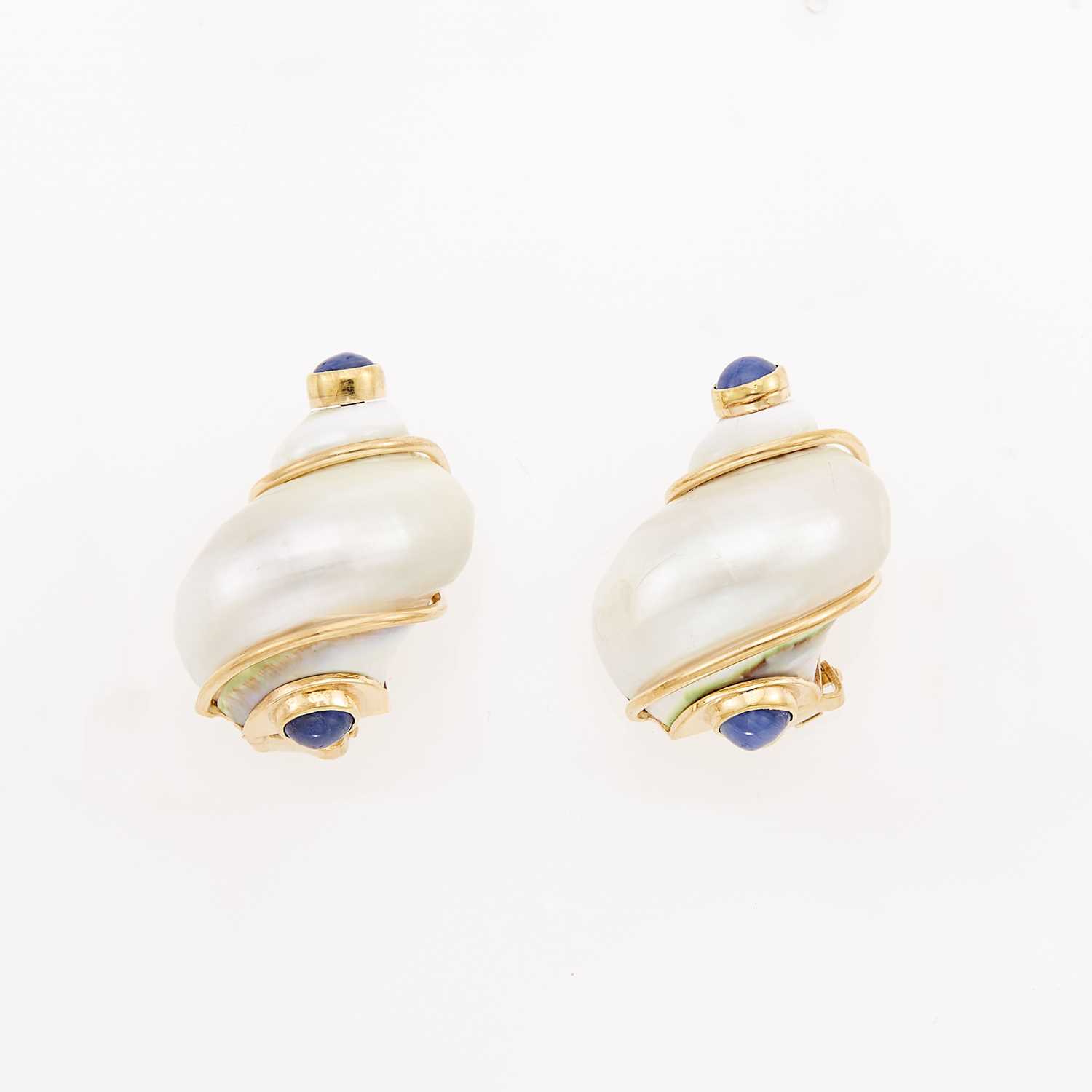 Lot 1029 - Seaman Schepps Pair of Shell, Gold and Cabochon Sapphire 'Turbo Shell' Earrings
