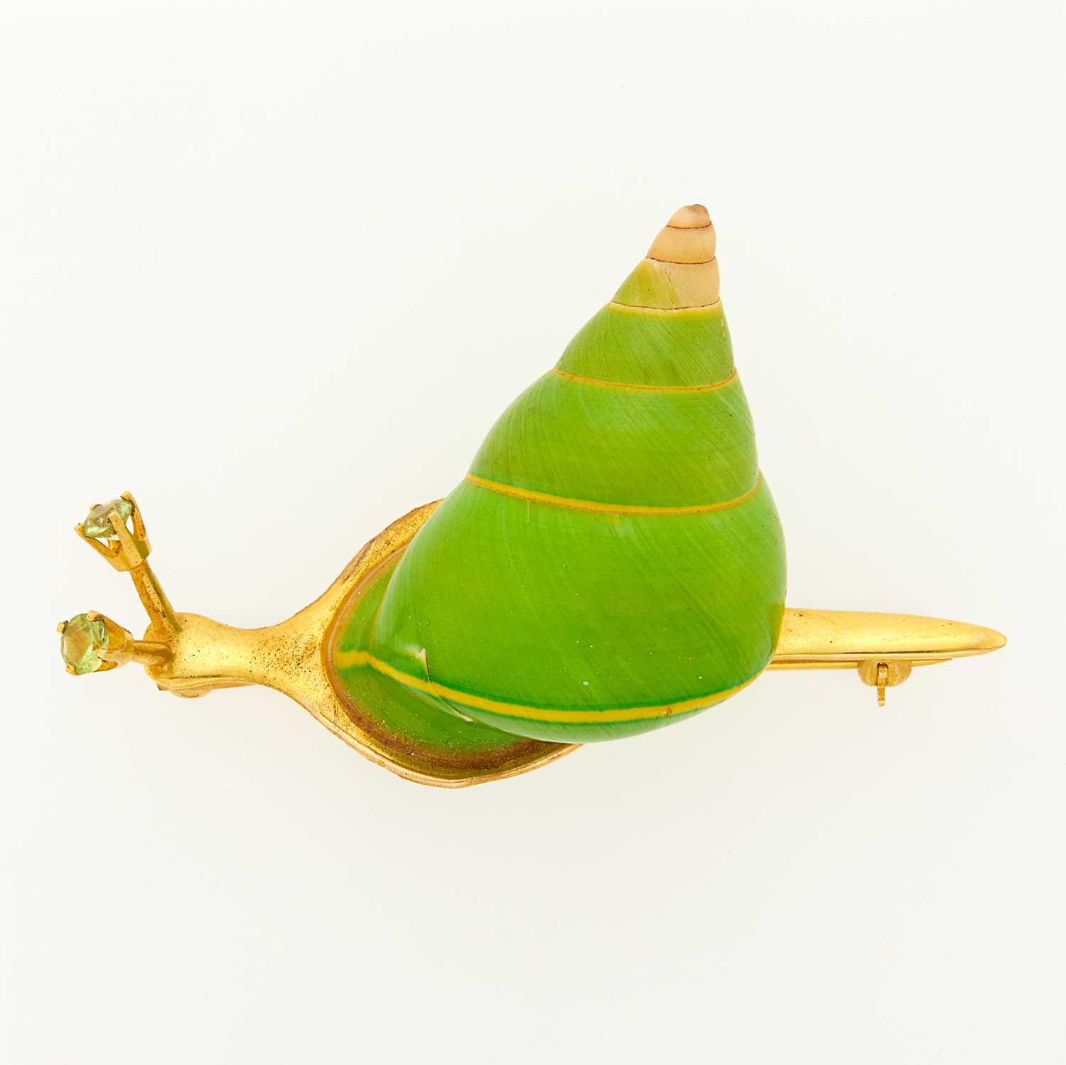 Lot 1129 - Gold, Enamel, Shell and Peridot Snail Brooch