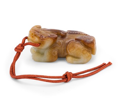 Lot 33 - A Chinese Mottled Jade Carving of a Beast