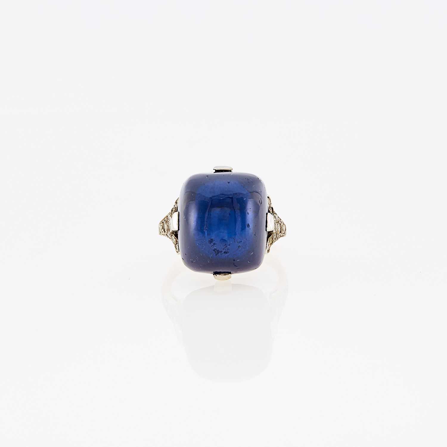 Lot 1078 - Platinum, Cabochon Synthetic Sapphire and Diamond Ring