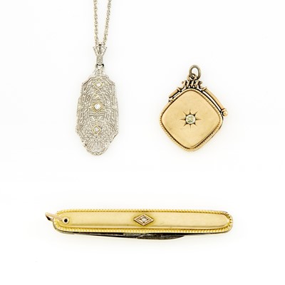 Lot 1139 - Two White and Yellow Gold, Gold-Filled, Metal and Diamond Pendants and Knife