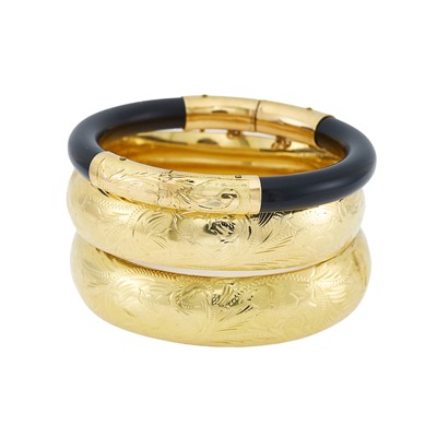 Lot 2221 - Two Gold Bangle Bracelets and Gold and Black Onyx Bangle Bracelet
