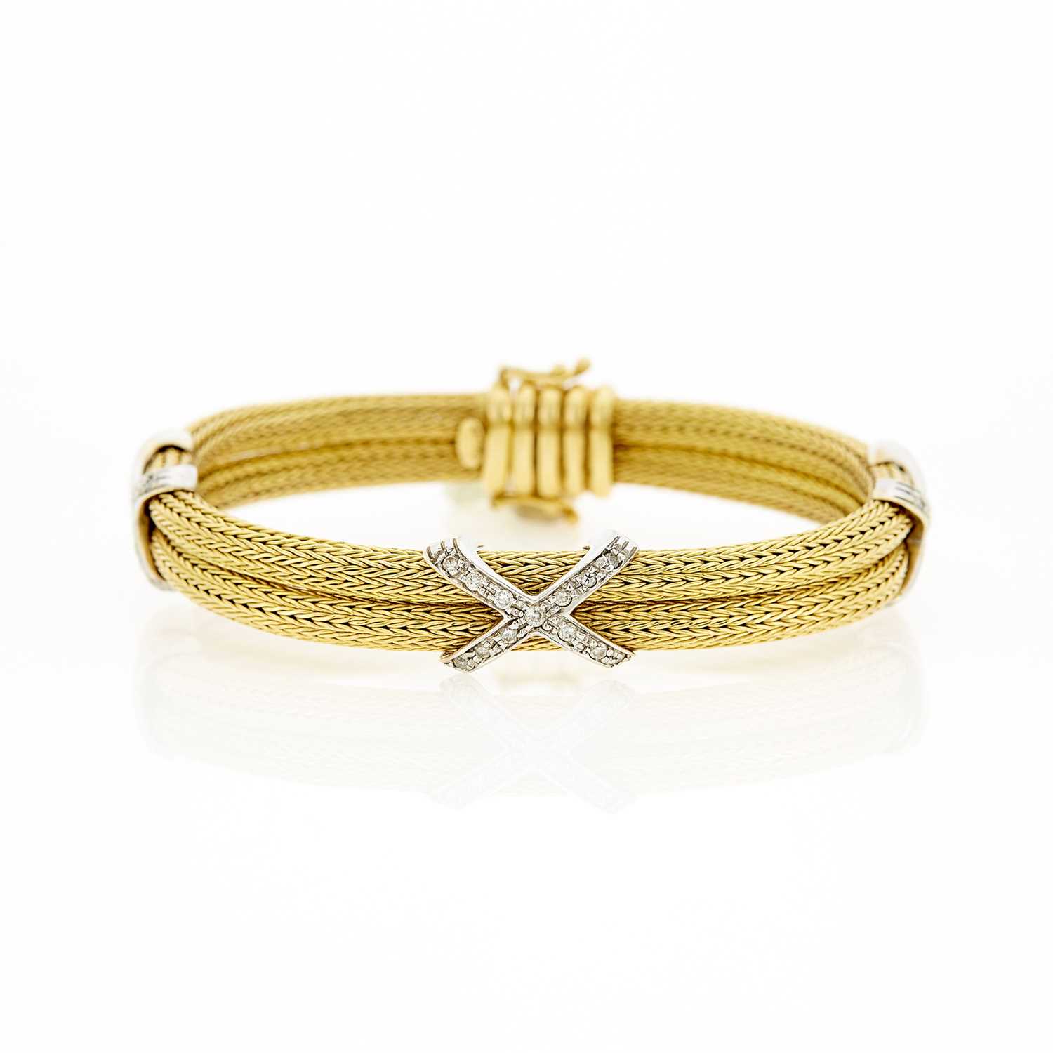 Lot 1030 - Two-Color Gold and Diamond 'X' Bangle Bracelet