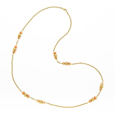 Lot 1067 - Long Gold and Carved Coral Bead Necklace