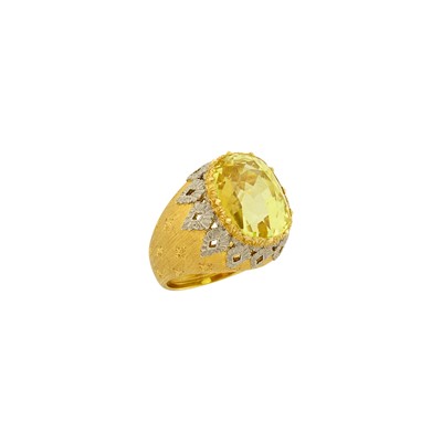 Lot 1243 - Mario Buccellati Two-Color Gold and Synthetic Yellow Sapphire Ring