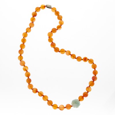 Lot 1127 - Long Agate Bead and Carved Jade Bead Necklace