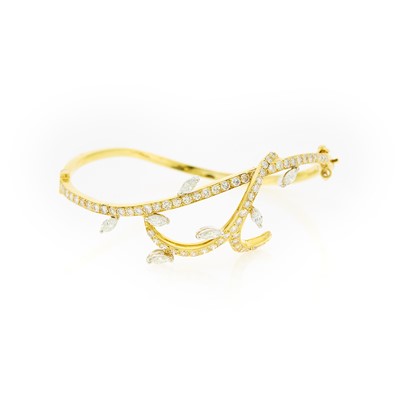 Lot 1202 - Two-Color and Diamond Bangle Bracelet