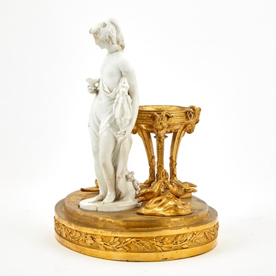 Lot 265 - Continental Gilt-Bronze and Bisque Porcelain Figure
