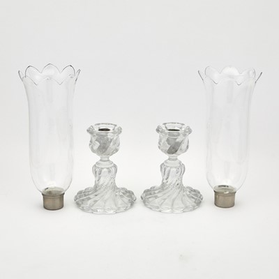 Lot 63 - Pair of Baccarat Blown and Molded Glass Candlesticks With Chimneys