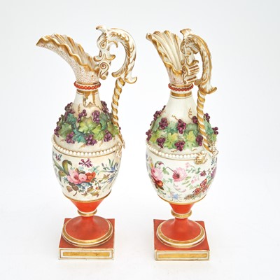 Lot 58 - Pair of Continental Gilt and Hand-Painted Porcelain Footed  Ewers