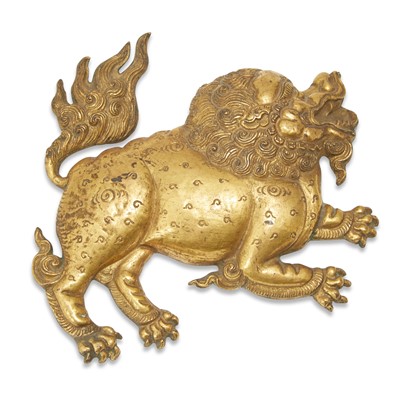 Lot 755 - A Tibetan Gilt Copper Repousse Lion Plaque