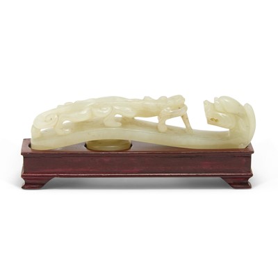 Lot 60 - A Chinese Celadon Jade Carving of Belt Hook