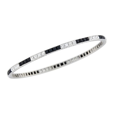Lot 179 - Platinum, Diamond and Black Onyx Bangle Bracelet