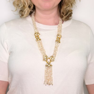 Lot 1113 - Twisted Seven Strand Baroque Freshwater Pearl, Two-Color Gold and Diamond Tassel Necklace