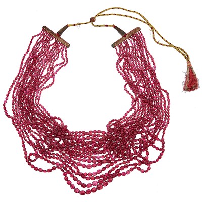 Lot 2192 - Sixteen Strand Ruby Bead Necklace with Cord