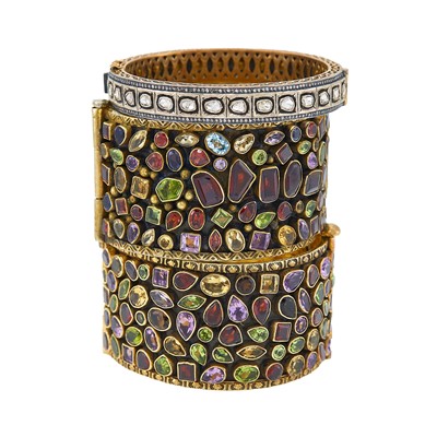Lot 2187 - Two Wide Silver-Gilt and Colored Stone Cuff Bracelets and Silver-Gilt and Foil-Backed Diamond Bangle Bracelet