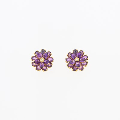 Lot 1145 - Tiffany & Co. Pair of Gold, Amethyst and Diamond Flower Earclips