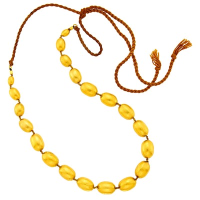 Lot 112 - High Karat Hammered Gold Bead Necklace with Cord