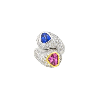 Lot 1057 - White Gold, Sapphire, Pink Sapphire and Diamond Bombé Crossover Ring