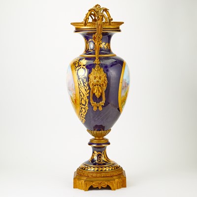 Lot 387 - Sèvres Style Gilt and Polychrome Decorated Cobalt Ground Porcelain Two-Handled Urn
