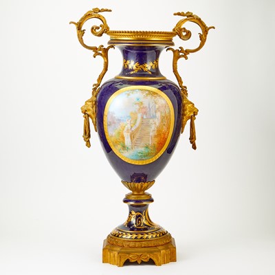 Lot 387 - Sèvres Style Gilt and Polychrome Decorated Cobalt Ground Porcelain Two-Handled Urn