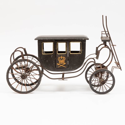 Lot 97 - Black Painted Tin Coach on Wheels