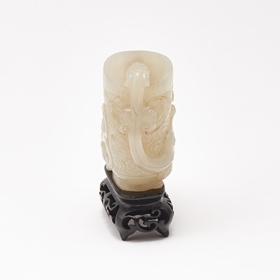 Lot 54 - A Chinese White Jade Cup and Stand