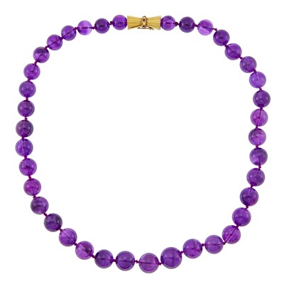 Lot 2208 - Amethyst Bead Necklace with Gold and Ruby Clasp