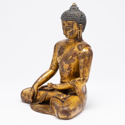 Lot 751 - A Tibetan Gilt Bronze Figure of Shakyamuni