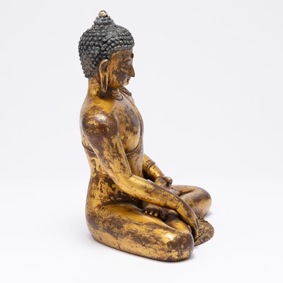 Lot 751 - A Tibetan Gilt Bronze Figure of Shakyamuni