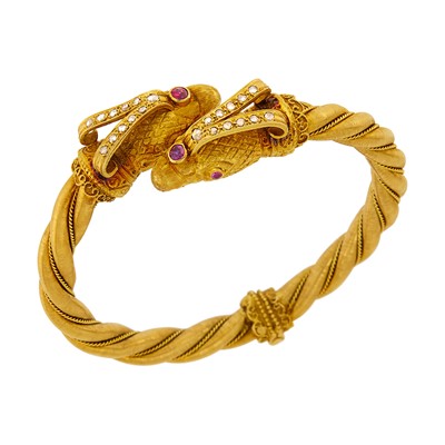 Lot 1005 - Zolotas Gold, Diamond and Ruby Eagle Head Crossover Bangle Bracelet