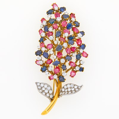 Lot 1205 - Jack Gutschneider Jewelry Co. Two-Color Gold, Ruby, Sapphire and Diamond Flower Clip-Brooch