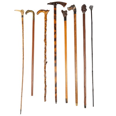 Lot 98 - Set of Eight Wooden Walking Canes with Animal Heads