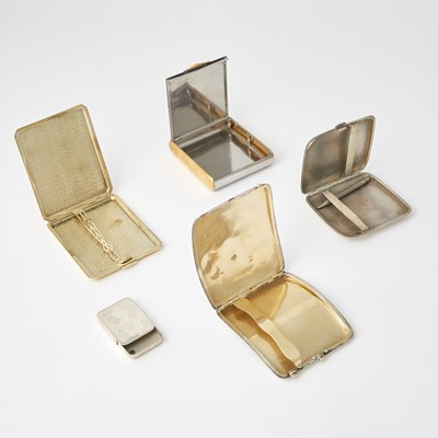 Lot 198 - A 14kt Gold Cigarette Case, Christofle Silver Plated Palmistry Hand, and Three Cigarette Cases