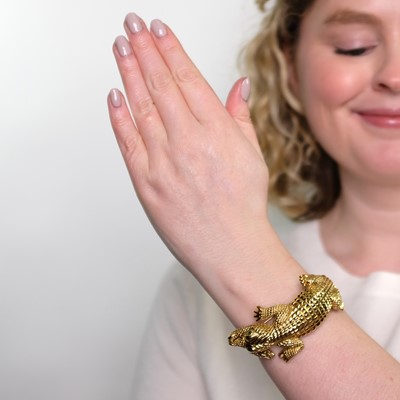 Lot 1194 - Gold and Emerald Alligator Bangle Bracelet