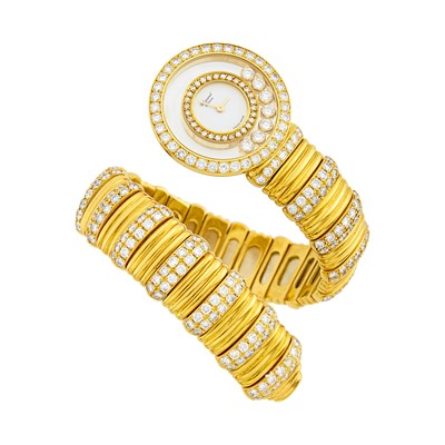 Lot 191 - Chopard Gold, Diamond and Cabochon Ruby 'Happy Diamonds' Bracelet-Watch