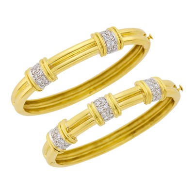 Lot 1017 - Pair of Two-Color Gold and Diamond Bangle Bracelets