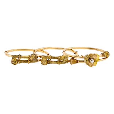 Lot 1118 - Pair of Etruscan Revival Two-Color Gold Bangle Bracelets and Diamond Bangle Bracelet