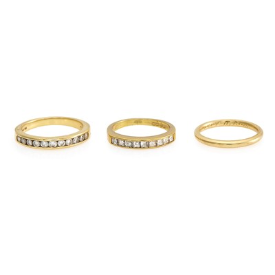 Lot 2026 - Tiffany & Co. Three Gold and Diamond Band Rings