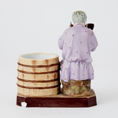 Lot 681 - Russian Porcelain Figure of a Man Drinking from a Barrel